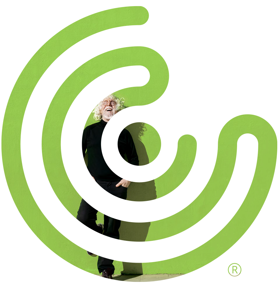 CC Logo with man against green wall